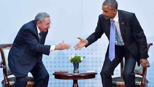 President Obama and President Raul Castro shake hands during a meeting in Panama