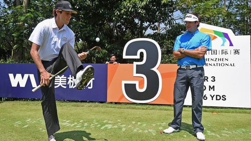 Bubba Watson (R) is entertained by trick shot artist and golfer Romain Bechu during the pro-am today