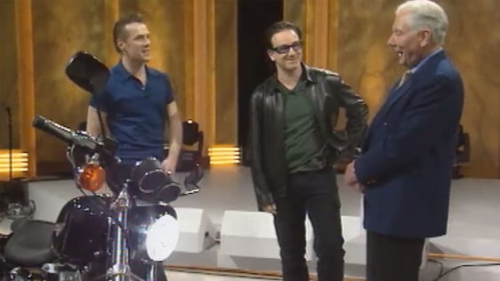 Larry Mullen and Bono with Gay Byrne who was presenting his last 'The Late Late Show'.