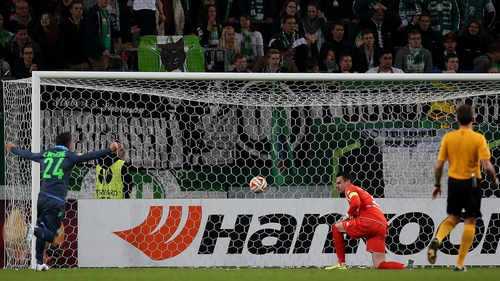 Wolfsburg's Swiss goalkeeper Diego Benaglio sees Napoli's third go in