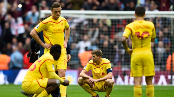 A dejected Steven Gerrard and his team-mates try to make sense of it all after the defeat by Aston Villa at Wembley