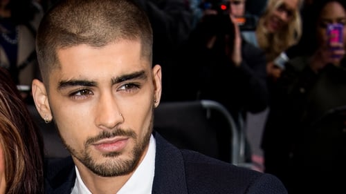 Stephen Hawking reckons Zayn could still be part of One Direction in another Universe.