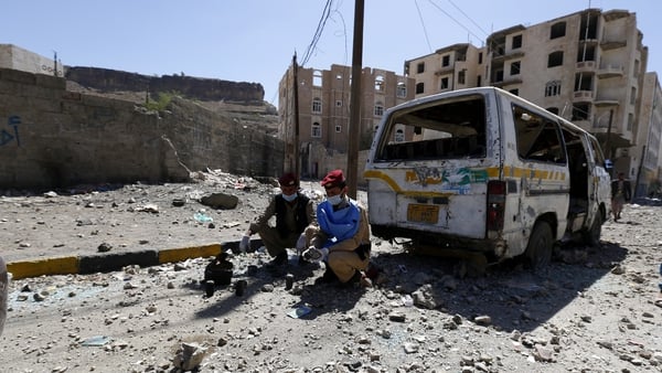 Yemeni deminers collect mines and explosives at the scene of an airstrike allegedly carried out by the Saudi-led coalition
