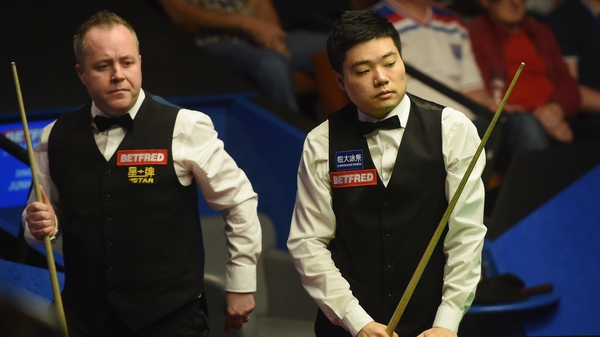 Ding Junhui of China looks on during his match with John Higgins