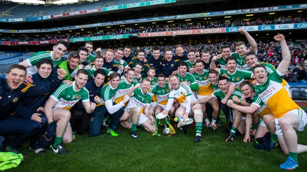 Offaly players celebrate with the cup on the Croke Park pitch