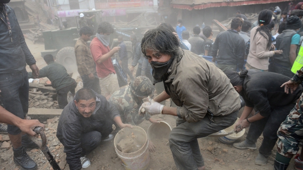 Residents work to clear the rubble in Kathmandu's Durbar Square, which is a UNESCO World Heritage Site
