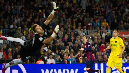 Lionel Messi watches the ball sail towards the net for his second goal of the night