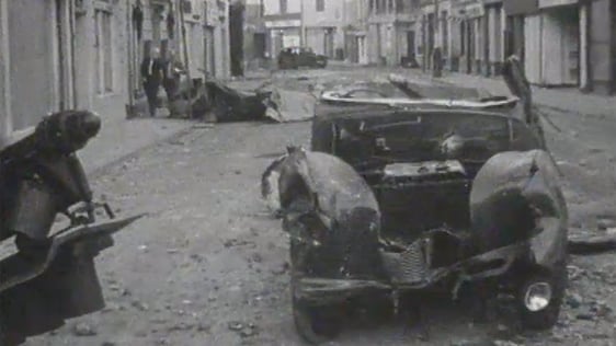Streets of Derry strewn with rubble, debris and burnt-out vehicles on 14 July 1979.