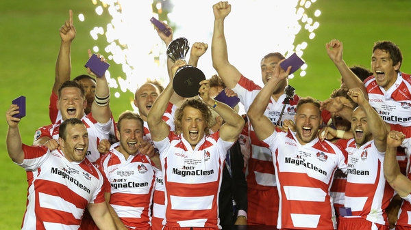 Billy Twelvetrees, the Gloucester captain, raises the Challenge Cup trophy