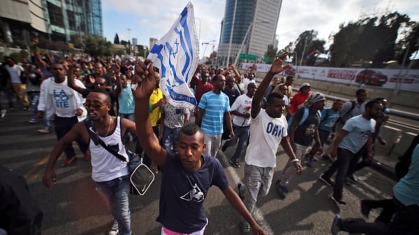 They marched onto the Ayalon highway, a central artery of Israel's commercial capital