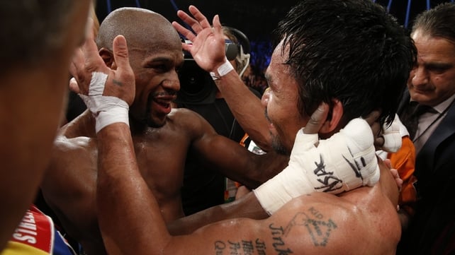 Floyd Mayweather Jr. hugs Manny Pacquiao afterwards