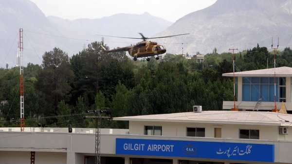 Image shows a helicopter flying over Gilgit Airport in 2013