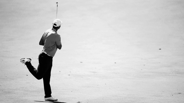 Tiger Woods plays his second shot on the on the 16th hole