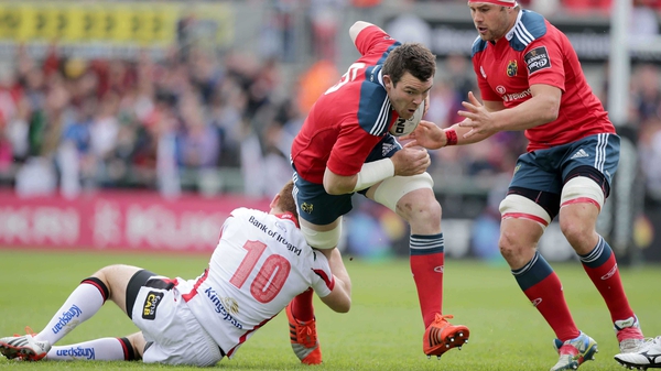 Munster's Peter O'Mahony is tackled by Ulster's by Paddy Jackson
