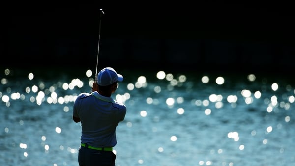 Rory McIlroy plays his second shot on the 18th