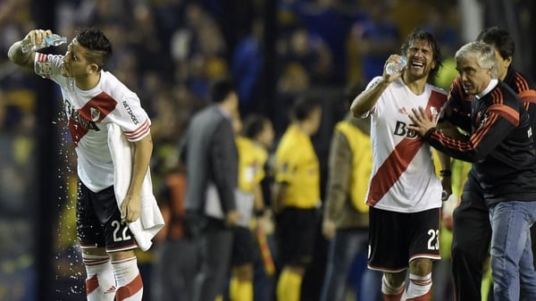 River Plate players in distress after being sprayed by Boca Junior fans