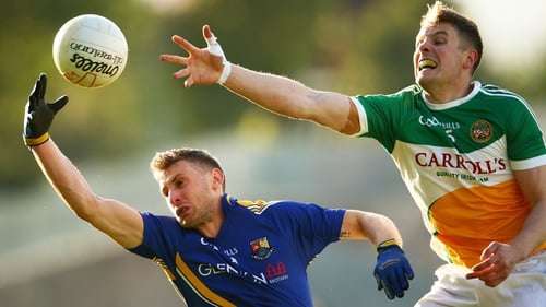 Offaly's Johnny Moloney and Ronan McEntire of Longford contest a loose ball