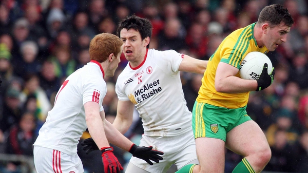 Donegal's Patrick McBrearty evades Tyrone's Peter Harte and Mattie Donnelly