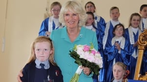 The Duchess of Cornwall meets Charlotte Elizabeth Curran who celebrated her 8th birthday during the Duchess' visit to Claddagh Primary School