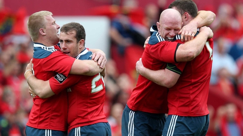 Munster players embrace at the final whistle