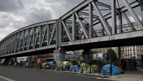 African migrants had been living in a makeshift camp underneath a metro bridge
