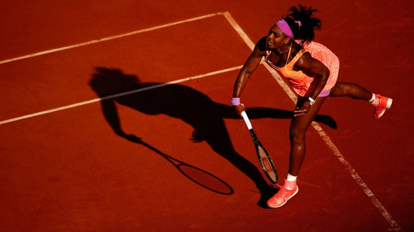 Serena Williams serves during her semi-final against Timea Bacsinszky