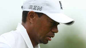 Tiger Woods feels the heat as he walks off the 18th green