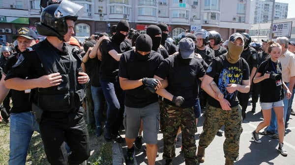 Policemen block anti-gay protesters during the Gay pride parade in Kiev