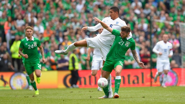 Chris Smalling and Daryl Murphy battle for the ball