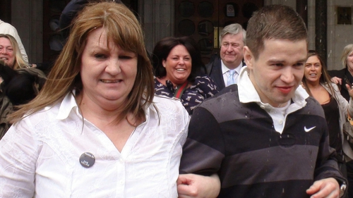 Sam Hallam leaving the Court of Appeal in London with his mother Wendy after he was freed on bail in 2012