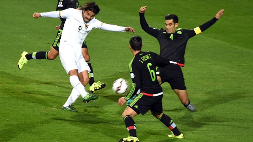 Bolivia's forward Marcelo Moreno is marked by Mexico's Rafael Marquez (R) and midfielder Javier Guemez (2-R)