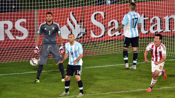 Paraguay's forward Nelson Haedo Valdez (R) celebrates after scoring against Argentina