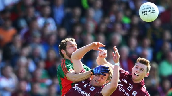 Galway's Gary O'Donnell and Tomas Flynn battle with Tom Parsons