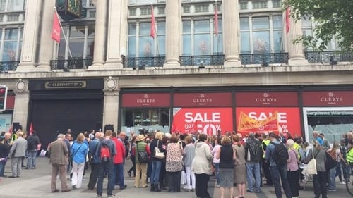 Workers and supporters gather under Clerys clock for a protest over its sudden closure