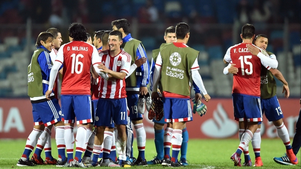 Paraguay players celebrate at full-time