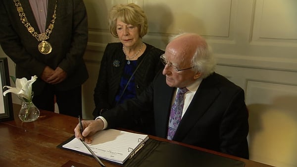 President Higgins signing the Berkeley book of condolences in June in Dublin