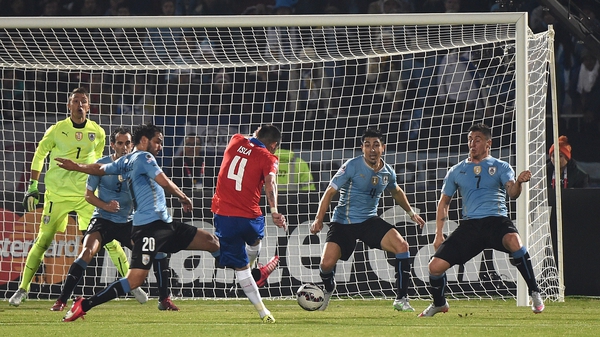 Chile's defender Mauricio Isla shoots and scores against Uruguay