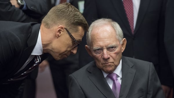 Finnish Finance Minister Alexander Stubb talks to German Finance Minister Wolfgan Schaeuble