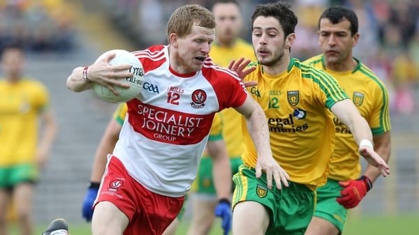 Derry's Enda Lynch tries to evade the attentions of Donegal's Ryan McHugh and Frank McGlynn