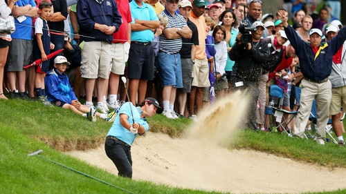 Brian Harman hits a bunker shot during the third round of the Travelers Championship
