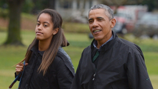 Malia and Barack Obama returning from a family vacation in Hawaii