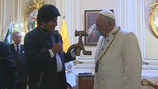 Pope Francis was presented with an image of Christ crucified superimposed on the Marxist symbol