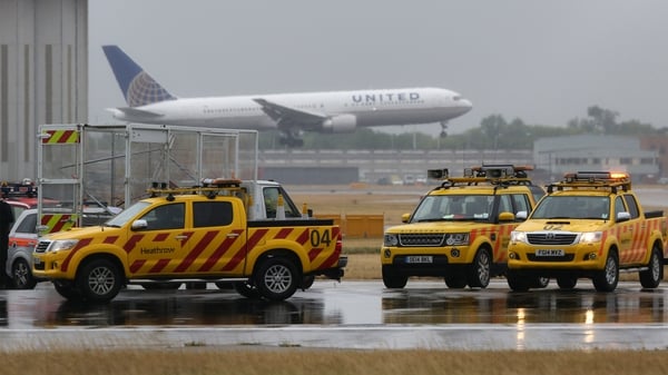Emergency services parked on the northern runaway at Heathrow Airport during a protest