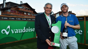 Michael Hoey collects a bottle of champagne and €30,000 following his hole-in-one
