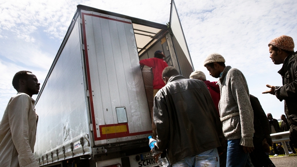 Migrants regularly try to board trucks travelling by the rail tunnel to Britain