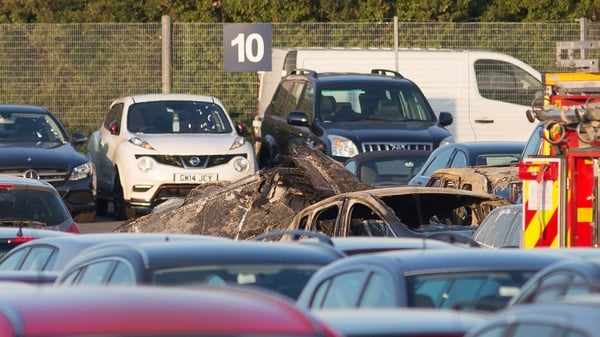 The plane crashed into a car auction site and burst into flames