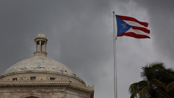The US island was supposed to pay about $58m in interest and principal on a bond but only made a partial payment on the interest