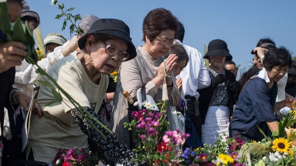 People offer prayers at the Hiroshima memorial