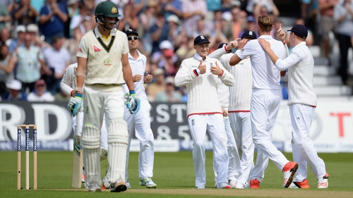England's Joe Root celebrates catching out Mitchell Starc
