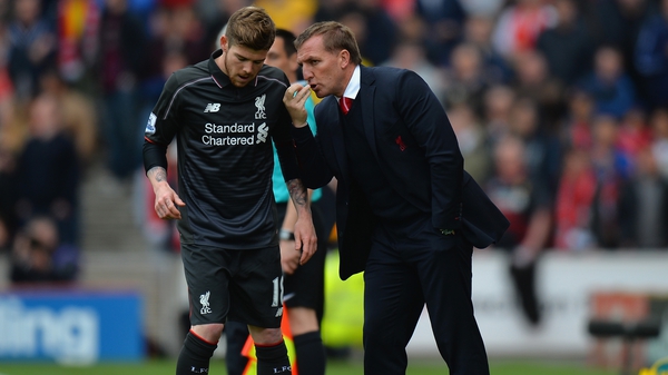 Brendan Rodgers speaks to Alberto Moreno during May's 6-1 defeat at Stoke